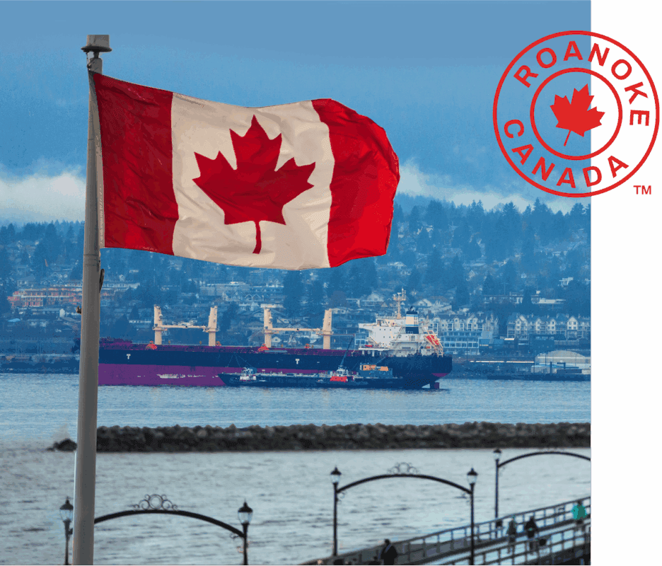 Canadian flag waving on a flagpole overlooking a waterfront harbor, with a cargo ship and hillside town in the background; a red circular ‘Roanoke Canada’ logo appears in the upper right corner.